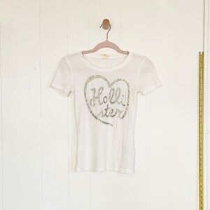 VINTAGE 2000s White Hollister Co. baby tee with glitter heart